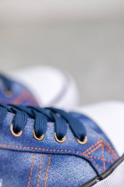 close up of denim sneakers 