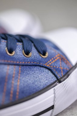 close up of denim sneakers