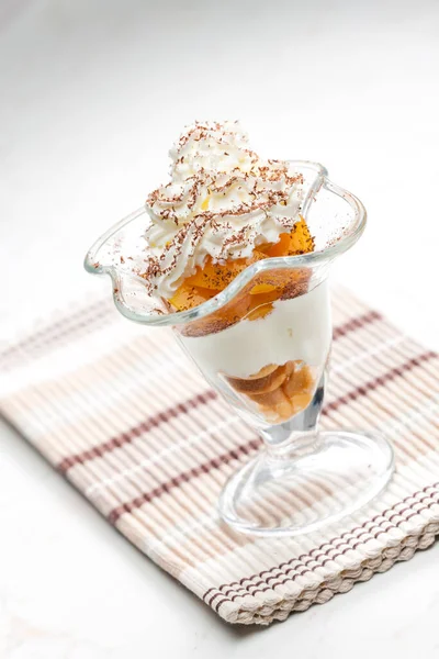 ice cream with stewed peach and whipped cream