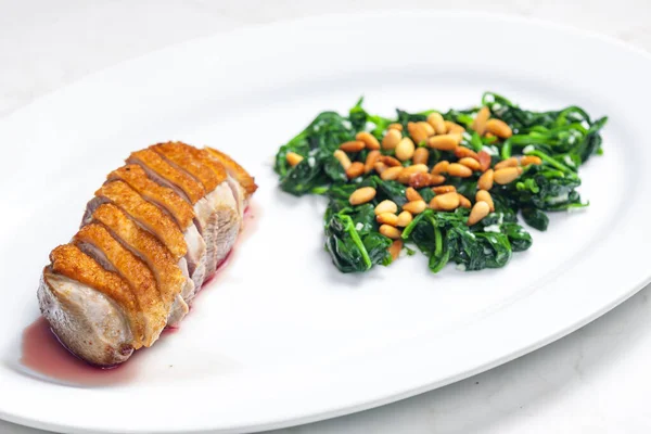 Roasted Duck Breast Served Salad Spinach Leaves Pine Nuts — Stock Photo, Image