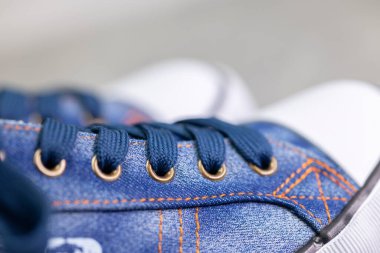 close up of denim sneakers