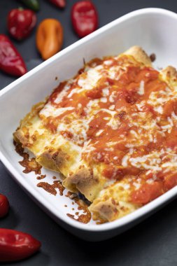 burritos baked with tomato sauce and cheddar cheese