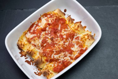 burritos baked with tomato sauce and cheddar cheese