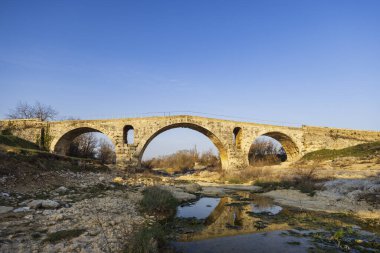 Pont Julien, roman stone arch bridge over Calavon river, Provence, France