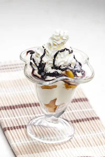 ice cream with stewed peach and whipped cream