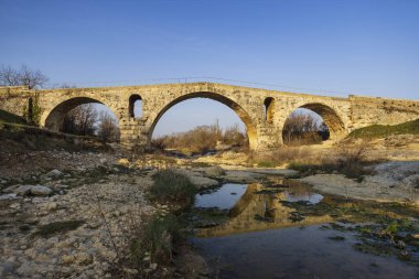 Pont Julien, roman stone arch bridge over Calavon river, Provence, France