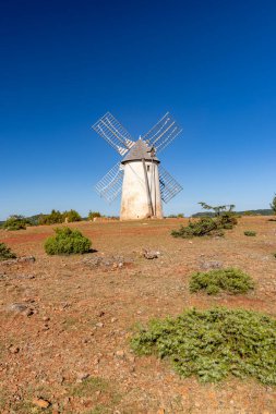 Windmill (Le Moulin de Redounel), La Couvertoirade in Larzac, Aveyron, France clipart