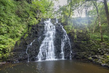 Waterfall Cascade de la Roche near Cheylade, French highlands, France clipart