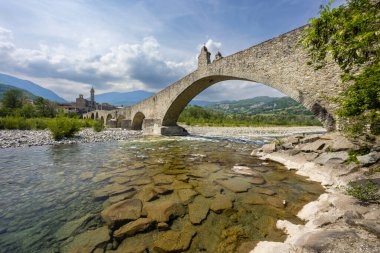 Gobbo Bridge also Devil Bridge or Ponte del Diavolo or Ponte Gobbo in Bobbio, Piacenza province, Trebbia Valley, Emilia Romagna, Italy clipart