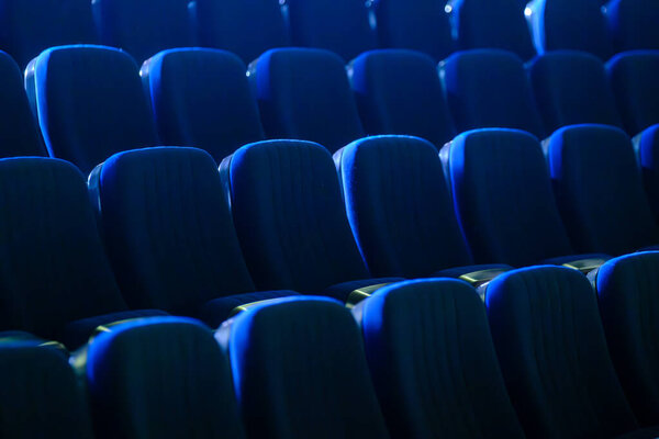 Full frame of blue velvet seats in empty auditorium at conference hall