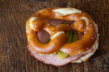 meatloaf slices in a pretzel on wood clipart