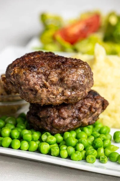 bavarian meat loafs with peas