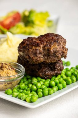 bavarian meat loafs with peas