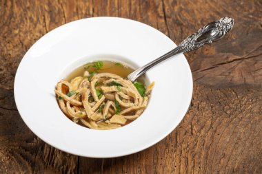 austrian pancake soup on wood 