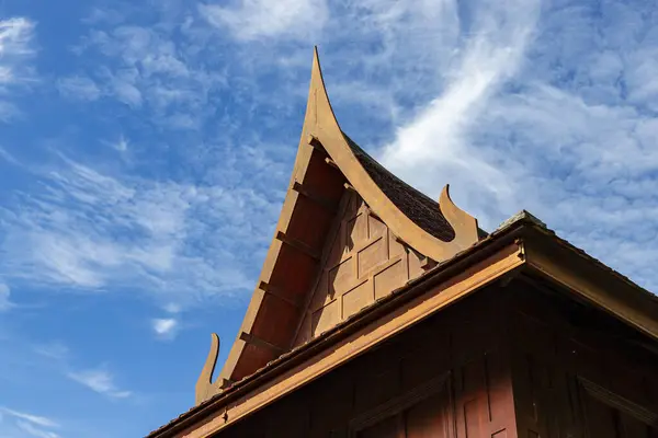 the roof of a Thai style house is a gable style. It has a triangular shape. The roof has a clear height. Good ventilation Helps keep the house cool and comfortable. It is the traditional roof.Blue sky