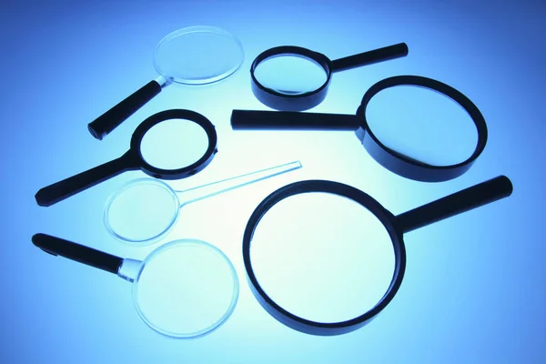 Magnifying Glasses Blue Background — Photo