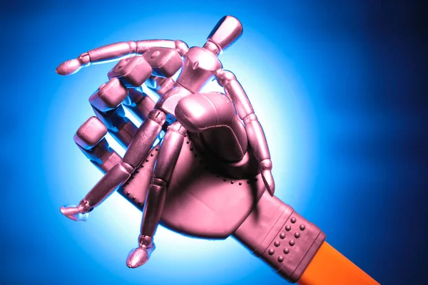 Robotic Hand Med Figur Royaltyfria Stockfoton