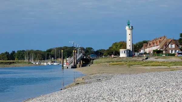 stock image Lighthouse of Cayeux sur Mer at the Pointe du Hourdel with its pebble beach. Cayeux sur Mer is a resort town in the Somme department in Hauts-de-France in northern France.The town is part of the Baie de Somme 