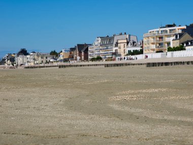 Beach at low tide and town at Le Crotoy a commune in the Somme department in Hauts-de-France in northern France 