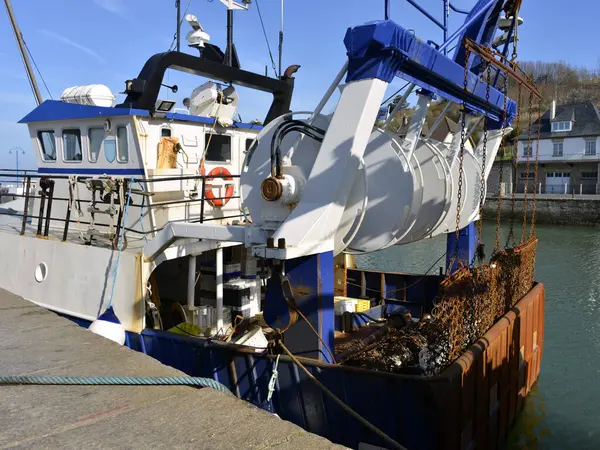 stock image Fishing boat in Port-en-Bessin, a commune in the Calvados department in the Basse-Normandie region in northwestern France. The commune contains the two towns of Port-en-Bessin and Huppain