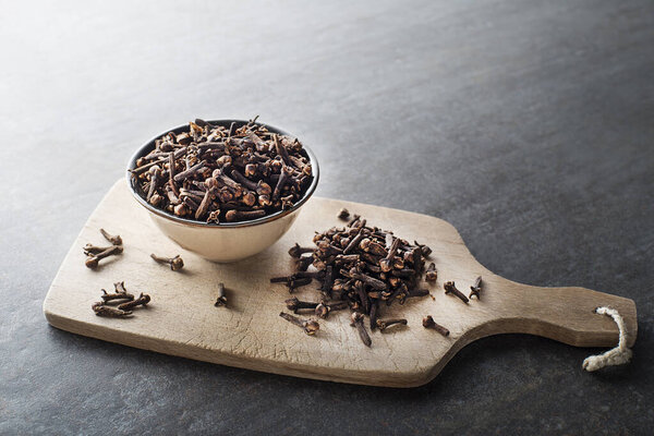 Cloves spice. Some dried cloves on grey background spice concept