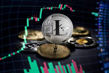 Litecoin cryptocurrency investing concept with graph. Bitcoin and Litecoin cryptocurrency coins symbol. Trading on the cryptocurrency exchange. Trends in litecoin and bitcoin exchange rates. Rise and fall chart of litecoin and bitcoin.