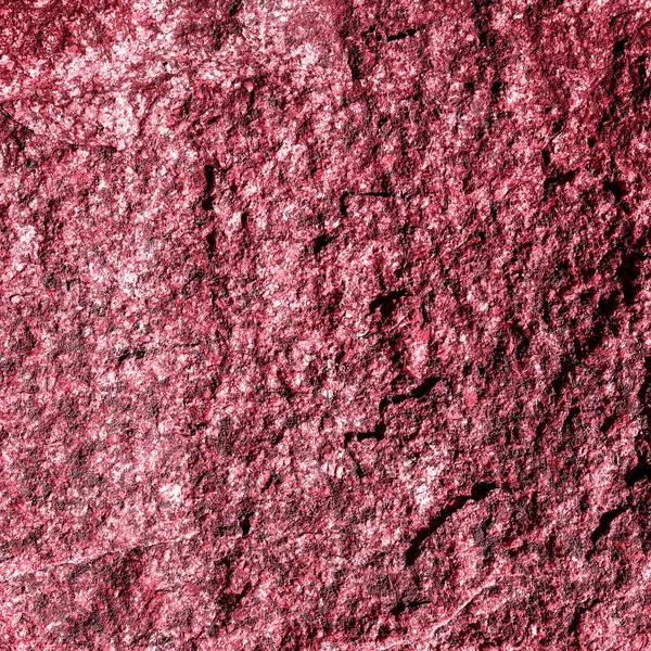 Taş dokusu yakın plan. Volkanik Kaya dokusu. 2023 'ün Renkli Tonu, Viva Magenta