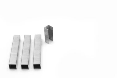 Metal staples for industrial and office stapler close-up on a white background