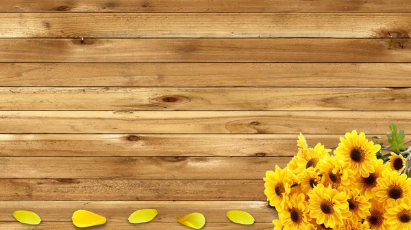 stock image bouquet of yellow chrysanthemums and flower petals on wooden background close up top view with blank space to insert text