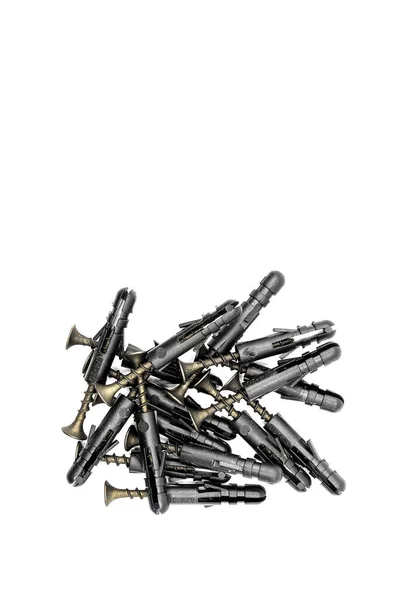 Eine Handvoll Schwarzer Dübel Mit Schwarzen Schrauben Auf Weißem Hintergrund — Stockfoto