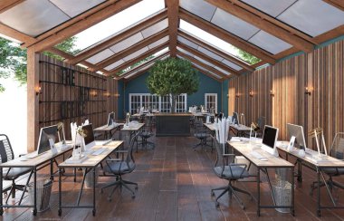 Ahşap zemini olan geniş, açık bir ofis. Yer masalar ve sandalyelerle dolu ve odanın her tarafına dağılmış birkaç saksı bitkisi var.