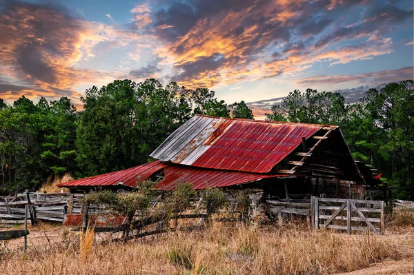 An Old Abandoned Run Down Barn at Sunset