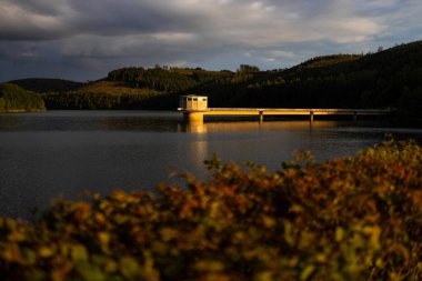 the german obernau dam in the siegerland clipart