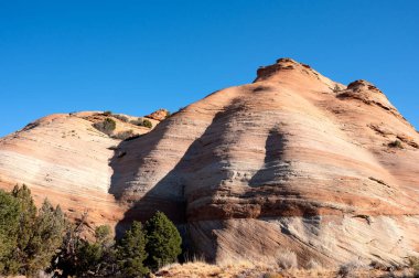 Unusual rock formation consisting mostly of red, Navajo Sandstone along the Burr Trail Road in Capitol Reef National Park in southern Utah. clipart