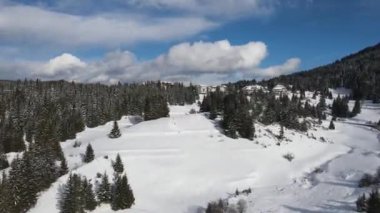 Aerial winter view of Rhodope Mountains around village of Stoykite and Pamporovo, Smolyan Region, Bulgaria