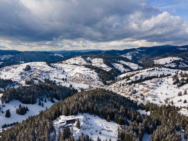 Aerial winter view of Rhodope Mountains around village of Stoykite and Pamporovo, Smolyan Region, Bulgaria