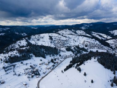 Aerial winter view of Rhodope Mountains around village of Stoykite and Pamporovo, Smolyan Region, Bulgaria