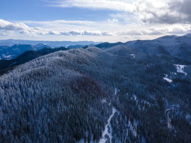 Aerial winter view of Rhodope Mountains around village of Stoykite and Pamporovo, Smolyan Region, Bulgaria