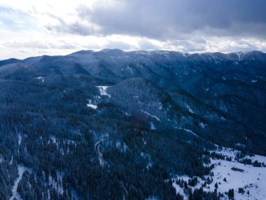 Aerial winter view of Rhodope Mountains around village of Stoykite and Pamporovo, Smolyan Region, Bulgaria
