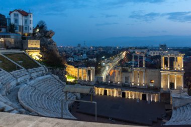 PLOVDIV, BULGARIA -FEBRUARY 24, 2023: Sunset view of Ruins of Ancient Roman theatre of Philippopolis in city of Plovdiv, Bulgaria