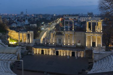 PLOVDIV, BULGARIA -FEBRUARY 24, 2023: Sunset view of Ruins of Ancient Roman theatre of Philippopolis in city of Plovdiv, Bulgaria