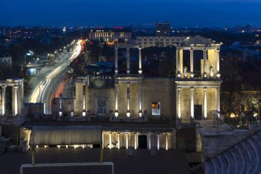 PLOVDIV, BULGARIA -FEBRUARY 24, 2023: Sunset view of Ruins of Ancient Roman theatre of Philippopolis in city of Plovdiv, Bulgaria