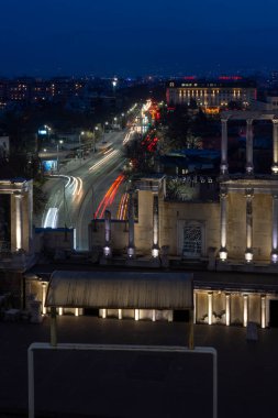 PLOVDIV, BULGARIA -FEBRUARY 24, 2023: Sunset view of Ruins of Ancient Roman theatre of Philippopolis in city of Plovdiv, Bulgaria