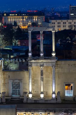 PLOVDIV, BULGARIA -FEBRUARY 24, 2023: Sunset view of Ruins of Ancient Roman theatre of Philippopolis in city of Plovdiv, Bulgaria