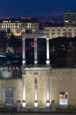 PLOVDIV, BULGARIA -FEBRUARY 24, 2023: Sunset view of Ruins of Ancient Roman theatre of Philippopolis in city of Plovdiv, Bulgaria