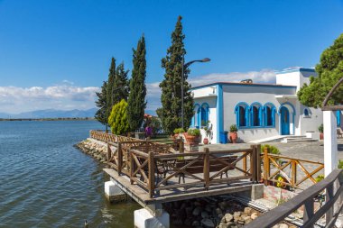 PORTO LAGOS, GREECE - SEPTEMBER 23, 2017: Saint Nicholas Monastery located on two islands in Porto Lagos, East Macedonia and Thrace, Greece clipart