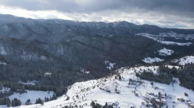 Aerial winter view of Rhodope Mountains around village of Stoykite and Pamporovo, Smolyan Region, Bulgaria