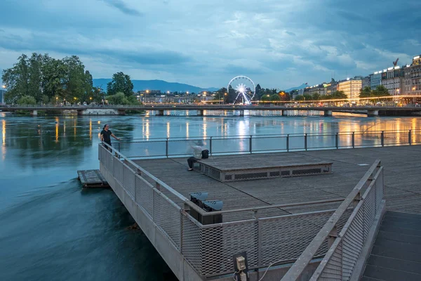 stock image GENEVA, SWITZERLAND - JUNE 19, 2023: Amazing Sunset view of Rhone River and city of Geneva, Switzerland