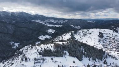 Aerial winter view of Rhodope Mountains around village of Stoykite and Pamporovo, Smolyan Region, Bulgaria