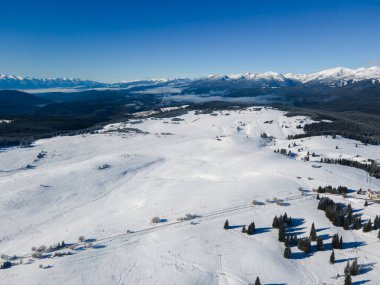 Amazing Aerial winter view of Rila mountain near Belmeken Dam, Bulgaria